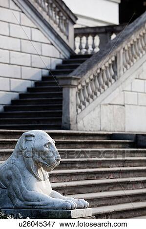 Stock Photo - Detail of facade of Renaissance Villa Melzi with steps to terraced zigzag stairway, carved stone balustrade, flanked by lion statue, Lake Como, Northern Italy. Fotosearch