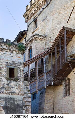 Picture - Detail view of back of medieval stone castle with merloned towers, and wooden balcony, Montefalco, Umbria, Italy. Fotosearch