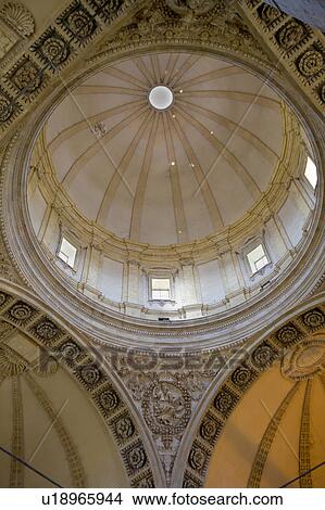 Picture - Detail view of interior of cupola of Tempio di Bramante, showing central dome and surrounding carved stone arches, Todi, Umbria, Italy. Fotosearch
