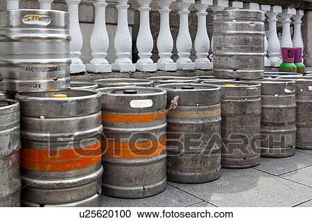 Stock Image - Early morning in Dublin, with empty metal beer kegs lined up beside white balustrade, Dublin, Southern Ireland. Fotosearch
