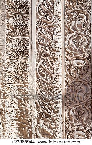 Picture - Exterior facade detail of Romanesque Basilica of Santa Caterina. with stylised carved stone decoration of birds and animals, Galatina, Salento, Puglia, Southern Italy. Fotosearch