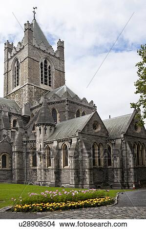 Picture - Exterior view from the south, of Christ Church Cathedral tower, and with lawn and flowerbeds, Dublin, Southern Ireland. Fotosearch