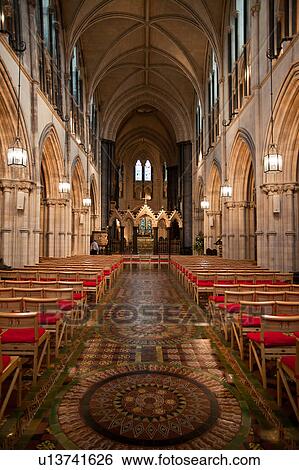 Interior view of central nave, with beautifully decorated pavement floor, lined with arches and columns, Romanesque ceiling, looking towards altar, Christ Church Cathedral, Dublin, Southern Ireland View Large Photo Image Stock Photograph - Interior view of central nave, with beautifully decorated pavement floor, lined with arches and columns, Romanesque ceiling, looking towards altar, Christ Church Cathedral, Dublin, Southern Ireland. Fotosearch