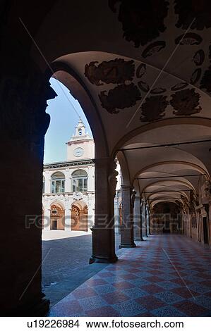 Picture - Loggia at entrance of Palazzo Archiginnasio, with view along portico, the two-tiered Renaissance buildings surrounding the courtyard beyond, Bologna, Italy. Fotosearch