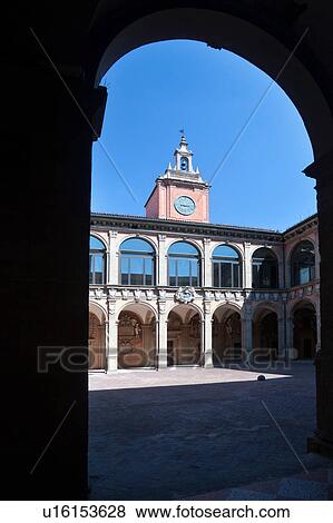 Loggia at entrance of Palazzo Archiginnasio, with view from under arch, of the two-tiered Renaissance buildings and central tower surrounding the courtyard, Bologna, Italy View Large Photo Image Stock Photo - Loggia at entrance of Palazzo Archiginnasio, with view from under arch, of the two-tiered Renaissance buildings and central tower surrounding the courtyard, Bologna, Italy. Fotosearch