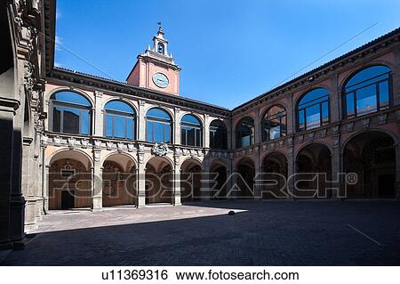 Loggia at entrance of Palazzo Archiginnasio, with view from under arch, of the two-tiered Renaissance buildings and central tower surrounding the courtyard, Bologna, Italy View Large Photo Image Stock Photograph - Loggia at entrance of Palazzo Archiginnasio, with view from under arch, of the two-tiered Renaissance buildings and central tower surrounding the courtyard, Bologna, Italy. Fotosearch