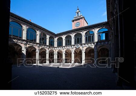 Loggia at entrance of Palazzo Archiginnasio, with view from under arch, of the two-tiered Renaissance buildings and central tower surrounding the courtyard, Bologna, Italy View Large Photo Image Stock Photography - Loggia at entrance of Palazzo Archiginnasio, with view from under arch, of the two-tiered Renaissance buildings and central tower surrounding the courtyard, Bologna, Italy. Fotosearch