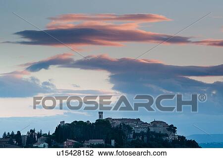 Medieval hilltop town of Monte Castello di Vibio, at sunrise, with pink clouds, skyscape, Umbria, Italy View Large Photo Image Stock Image - Medieval hilltop town of Monte Castello di Vibio, at sunrise, with pink clouds, skyscape, Umbria, Italy. Fotosearch