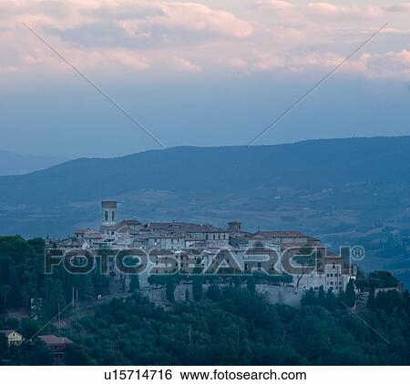 Medieval hilltop town of Monte Castello di Vibio, at sunrise, with pink clouds, skyscape, Umbria, Italy View Large Photo Image Stock Photograph - Medieval hilltop town of Monte Castello di Vibio, at sunrise, with pink clouds, skyscape, Umbria, Italy. Fotosearch