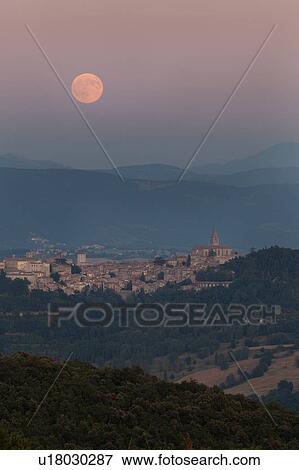 Moonrise over Todi, Umbria, with view of medieval hilltop town in foreground, and full moon over mountains in background. View Large Photo Image Stock Photo - Moonrise over Todi, Umbria, with view of medieval hilltop town in foreground, and full moon over mountains in background.. Fotosearch