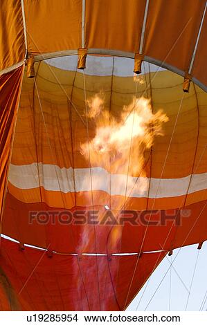 Picture - Orange interior of balloon before take-off, with flames. Fotosearch
