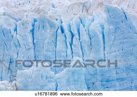 Stock Photograph - Perito Moreno Glacier, early morning, cloudy autumn day, blue ice detail, Los Glaciares, Argentina, Patagonia. Fotosearch