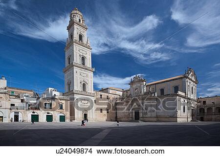 Picture - Piazza del Duomo, with view of campanile (bell tower) and Baroque ornamentation of Cathedral, sunny spring morning with blue sky, Lecce, Salento, Puglia, Southern Italy. Fotosearch