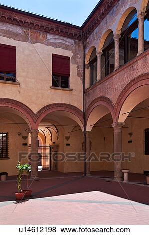 Stock Photo - Renaissance courtyard of Palazzo Paleotti, with typical arched portico, windows arched and rectangular on first floor, and tiled pavimenti flooring, Bologna, Italy. Fotosearch