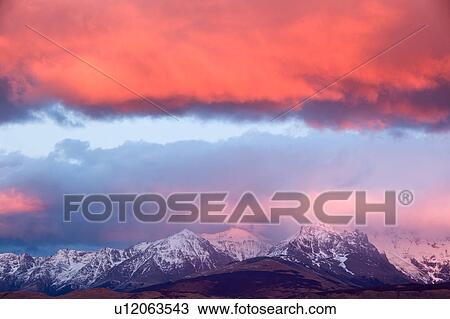 Sunrise over the Andes mountain range, El Chalten, Argentina, Patagonia, with stunning pink and blue skyscape. View Large Photo Image Stock Image - Sunrise over the Andes mountain range, El Chalten, Argentina, Patagonia, with stunning pink and blue skyscape.. Fotosearch