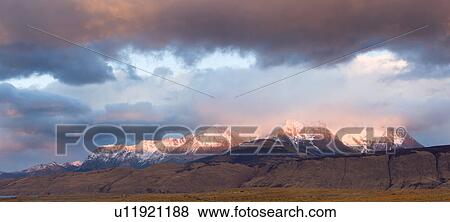 Stock Photo - Sunrise over the Andes mountain range, El Chalten, Argentina, Patagonia, with stunning pink and blue skyscape.. Fotosearch