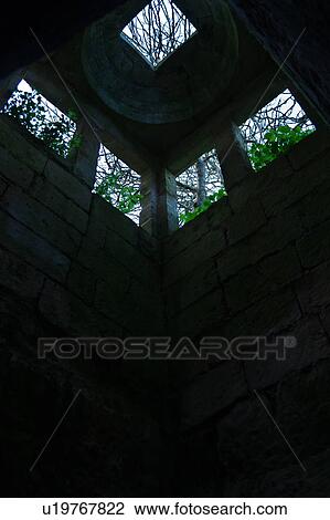 Tower as seen from below, underground cavern lit from above, used for oil production and storage, monastery ruin, Salento, Puglia, Southern Italy View Large Photo Image Stock Image - Tower as seen from below, underground cavern lit from above, used for oil production and storage, monastery ruin, Salento, Puglia, Southern Italy. Fotosearch