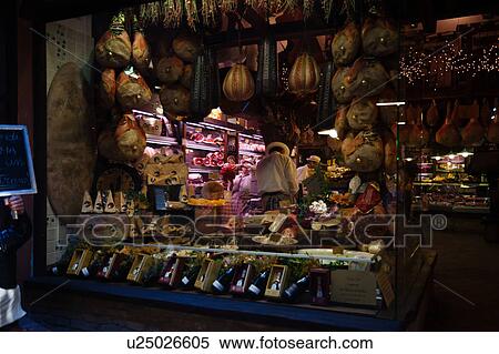 Typical window display of delicatessen shop with display of local produce of meat, cheese, wines for sale, Bologna, Italy View Large Photo Image Stock Photography - Typical window display of delicatessen shop with display of local produce of meat, cheese, wines for sale, Bologna, Italy. Fotosearch