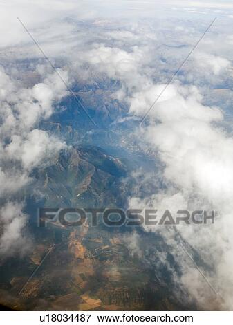 Stock Photo - View of Cordillera range of mountains and fields as seen from aeroplane, Santiago, Chile. Fotosearch