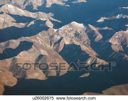 View of Cordillera range of mountains from aeroplane, with texture effect of sun and shadow, Santiago, Chile View Large Photo Image Stock Photography - View of Cordillera range of mountains from aeroplane, with texture effect of sun and shadow, Santiago, Chile. Fotosearch