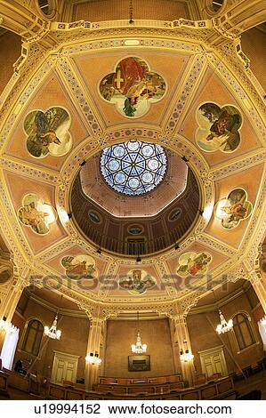 Stock Image - View of octagonal ceiling of Sala del Consiglio, Perugia, with central oculus, and eight frescoes of mythical female figures, representing towns of Umbria. Fotosearch