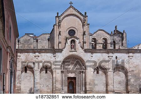 View of Romanesque facade of church of San Giovanni, with typical stone carved scroll work and statues, arched loggia, sunny spring afternoon with blue sky, Matera, Puglia, Southern Italy View Large Photo Image Stock Image - View of Romanesque facade of church of San Giovanni, with typical stone carved scroll work and statues, arched loggia, sunny spring afternoon with blue sky, Matera, Puglia, Southern Italy. Fotosearch