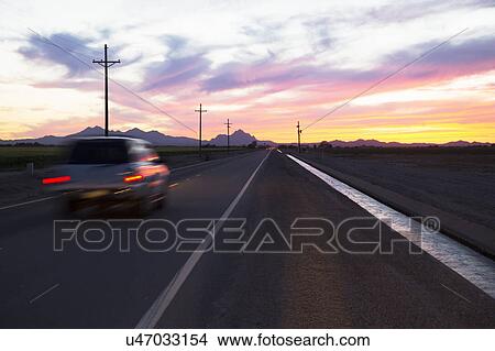 Arizona, Tucson, USA, April 5, 2015, sunset on Arizona highway View Large Photo Image Picture - Arizona, Tucson, USA, April 5, 2015, sunset on Arizona highway. Fotosearch