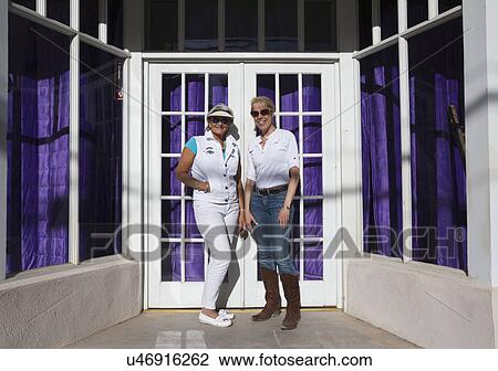 Bisbee, Arizona, USA, April 6, 2015, Phylis Tampio and Leslie Plimpton pose in front of purple draped doorway View Large Photo Image Stock Image - Bisbee, Arizona, USA, April 6, 2015, Phylis Tampio and Leslie Plimpton pose in front of purple draped doorway. Fotosearch