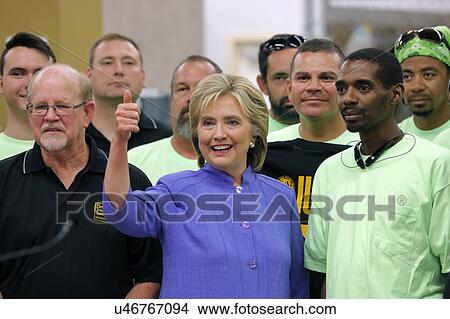 Picture - HENDERSON, NV - OCTOBER 14, 2015: Democratic U. S. presidential candidate & former Secretary of State Hillary Clinton smiles and gives thumbs up at International Union of Painters and Allied Trades (IUPAT) training center. Fotosearch