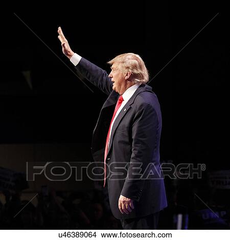 Picture - LAS VEGAS NEVADA, DECEMBER 14, 2015: Republican presidential candidate Donald Trump waves at campaign event at Westgate Las Vegas Resort & Casino the day before the CNN Republican Presidential Debate. Fotosearch