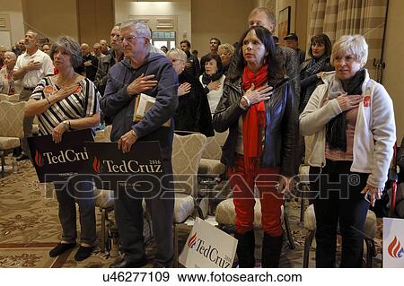 Stock Photo - LAS VEGAS, NEVADA, DECEMBER 17, 2015: Political supporters of Republican Presidential candidate Sen. Ted Cruz holds hand on for pledge allegiance, R-Texas, Siena Community Ballroom, Las Vegas, NV. Fotosearch