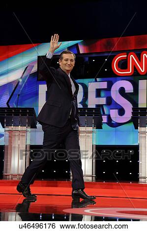 Stock Photograph - LAS VEGAS, NV, Dec 15, 2015, Senator Ted Cruz, a Republican from Texas and 2016 presidential candidate, walks and waves on stage at the start of the Republican presidential candidate debate at The Venetian.. Fotosearch