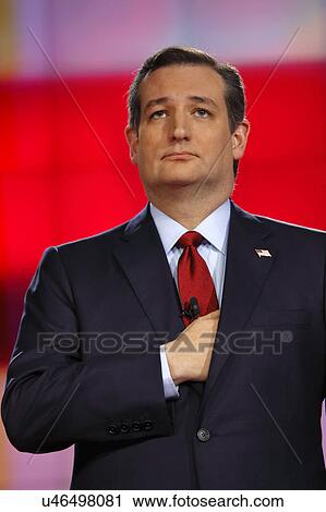 Stock Image - LAS VEGAS, NV - DECEMBER 15: Republican presidential candidate US Senator Ted Cruz holds hand over heart and under his jacket at CNN republican presidential debate at The Venetian, December 15, 2015, Las Vegas, Nevada. Fotosearch