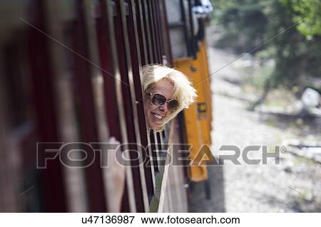 Leslie Plimpton sticks head out train window, antique train Silverton to Durango Colorado View Large Photo Image Stock Photo - Leslie Plimpton sticks head out train window, antique train Silverton to Durango Colorado. Fotosearch