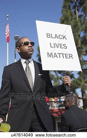 Los Angeles, California, USA, January 19, 2015, 30th annual Martin Luther King Jr. Kingdom Day Parade, black man hold sign "Black Lives Matter" View Large Photo Image Stock Photo - Los Angeles, California, USA, January 19, 2015, 30th annual Martin Luther King Jr. Kingdom Day Parade, black man hold sign "Black Lives Matter". Fotosearch