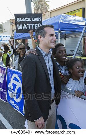 Stock Photo - Los Angeles, California, USA, January 19, 2015, 30th annual Martin Luther King Jr. Kingdom Day Parade, LA Mayor Eric Garcetti with sign "Black Lives Matter". Fotosearch