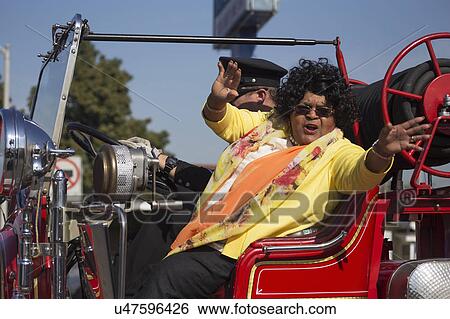 Stock Photograph - Los Angeles, California, USA, January 19, 2015, 30th annual Martin Luther King Jr. Kingdom Day Parade, black woman smiles in parade. Fotosearch
