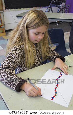 Stock Photo - Oak View, California, USA, December 15, children doing finger painting after school. Fotosearch