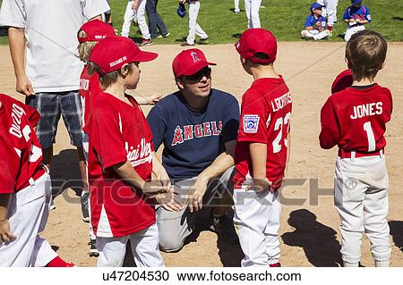 Oak View, California, USA, March 7, 2015, Ojai Valley Little League Field, youth Baseball, Spring, coach speaks to Tee-Ball Division players View Large Photo Image Stock Image - Oak View, California, USA, March 7, 2015, Ojai Valley Little League Field, youth Baseball, Spring, coach speaks to Tee-Ball Division players. Fotosearch