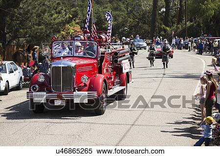 Stock Photography - Oak View, California, USA, May 24, 2015, antique fire engine leads Memorial Day Parade. Fotosearch