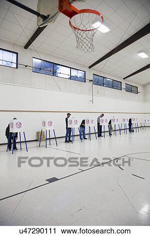 Oak View, California, USA, November 4, 2014, citizen votes in election booth polling station in gymnasium View Large Photo Image Stock Image - Oak View, California, USA, November 4, 2014, citizen votes in election booth polling station in gymnasium. Fotosearch