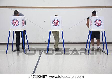 Oak View, California, USA, November 4, 2014, citizen votes in election booth polling station in gymnasium View Large Photo Image Stock Photo - Oak View, California, USA, November 4, 2014, citizen votes in election booth polling station in gymnasium. Fotosearch