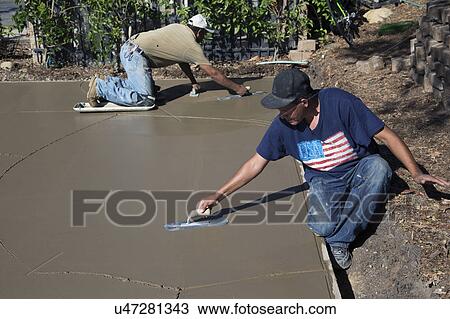 Oak View, California, USA, October 18, 2014, Hispanic concrete workers spread wet concrete for driveway View Large Photo Image Stock Image - Oak View, California, USA, October 18, 2014, Hispanic concrete workers spread wet concrete for driveway. Fotosearch