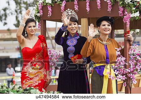 Picture - Orange County, City of Westminster, Southern California, USA, February 21, 2015, Little Saigon, Vietnamese-American Community, TET Parade celebrates Tet Lunar New Year, women wave. Fotosearch