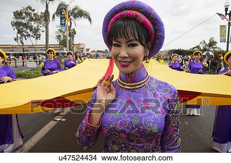 Picture - Orange County, City of Westminster, Southern California, USA, February 21, 2015, Little Saigon, Vietnamese-American Community, TET Parade celebrates Tet Lunar New Year, women march in parade. Fotosearch