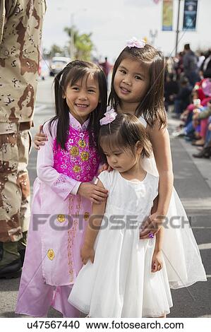 Stock Image - Orange County, City of Westminster, Southern California, USA, February 21, 2015, Little Saigon, Vietnamese-American Community, TET Parade celebrates Tet Lunar New Year, little girls. Fotosearch
