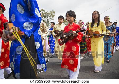 Stock Photograph - Orange County, City of Westminster, Southern California, USA, February 21, 2015, Little Saigon, Vietnamese-American Community, TET Parade celebrates Tet Lunar New Year, marching violin players. Fotosearch