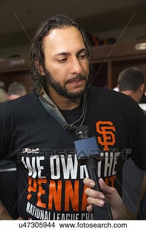 Picture - San Francisco, California, USA, October 16, 2014, AT&T Park, baseball stadium, SF Giants versus St. Louis Cardinals, National League Championship Series (NLCS), Angel Pagan in lockerroom celebrating victory. Fotosearch