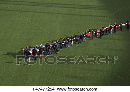 Picture - San Francisco, California, USA, October 16, 2014, AT&T Park, baseball stadium, SF Giants versus St. Louis Cardinals, National League Championship Series (NLCS). large US Flag opening ceremonies. Fotosearch