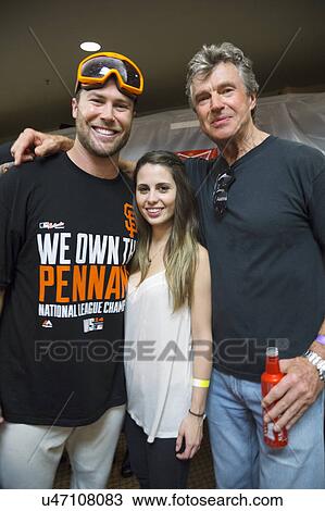 Stock Image - San Francisco, California, USA, October 16, 2014, AT&T Park, baseball stadium, SF Giants versus St. Louis Cardinals, National League Championship Series (NLCS), Hunter Strickland (left), his wife Shelley and Uncle Bill Terry. Fotosearch